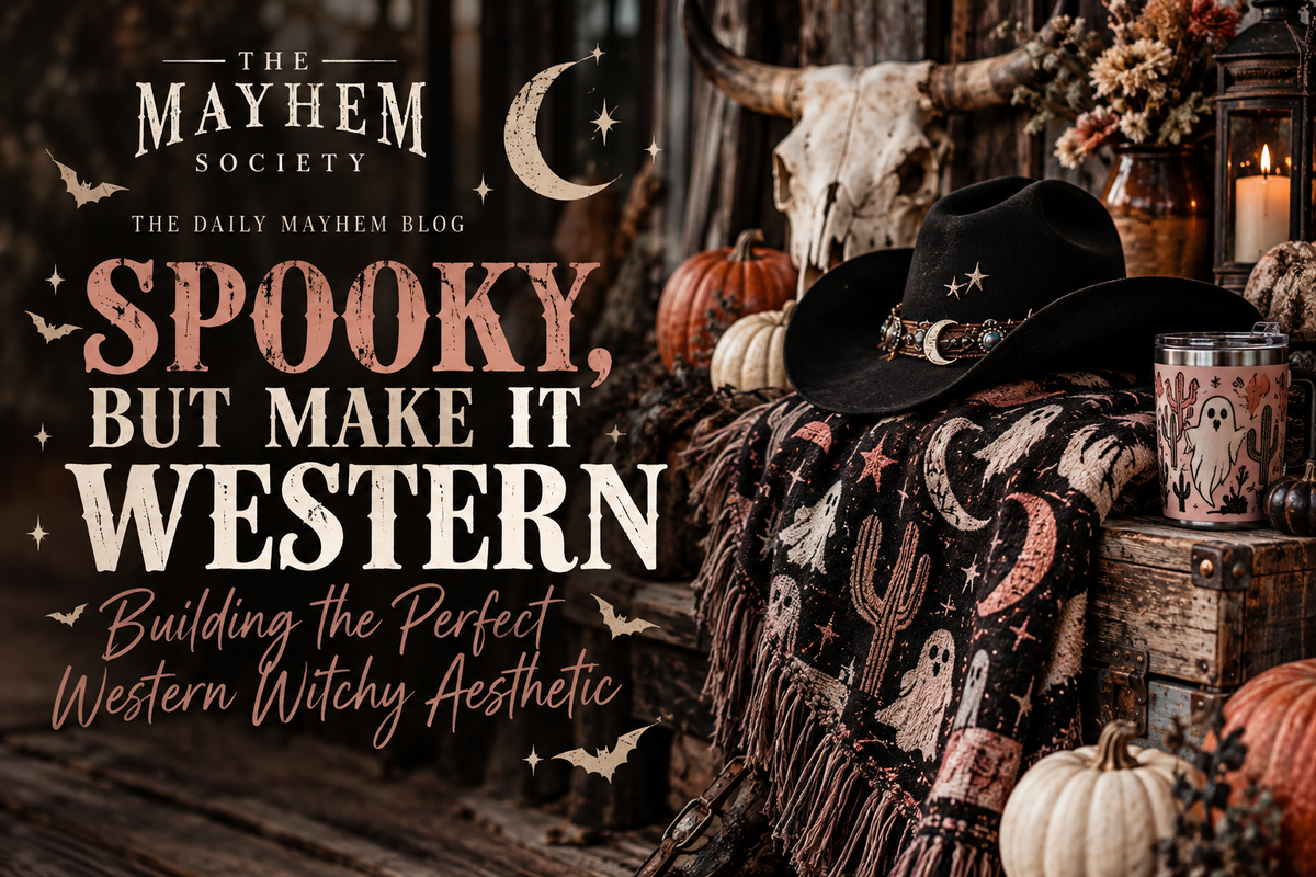 Western witchy Halloween scene with black cowboy hat, crescent moons, pumpkins and spooky decor for The Mayhem Society blog.