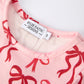 Pink Bow Print Girls Dress with Ruffle Hem
